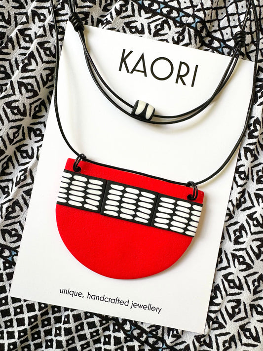 Black, Red and White Rice Pendant on adjustable length Leather cord